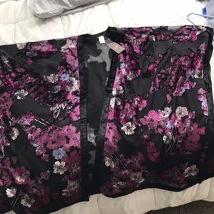 Black floral cover. One size fits most. NWT